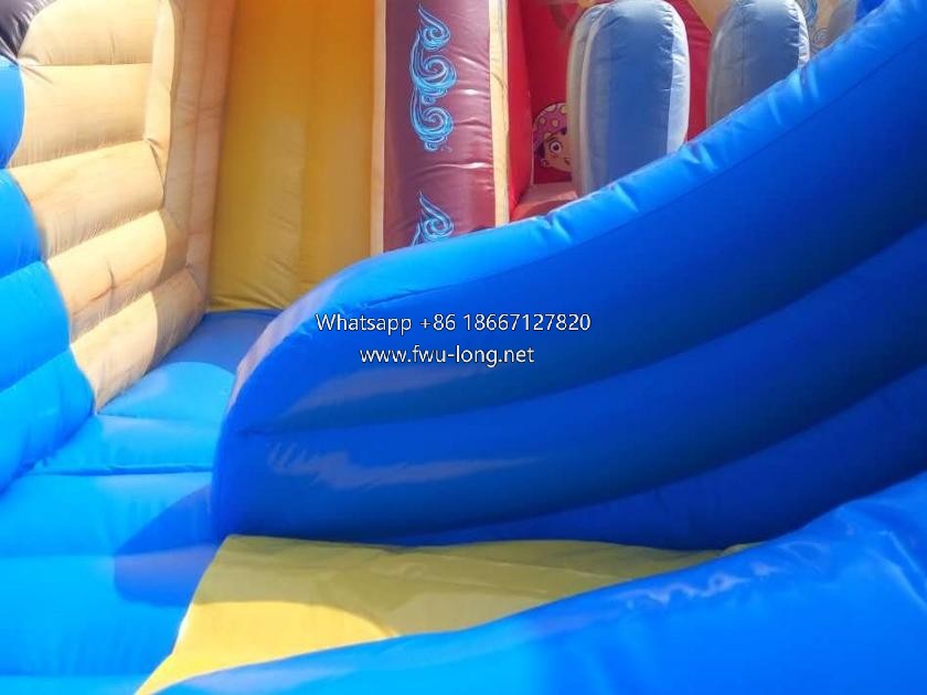 Internal bounce, slide and pirate decorative print detail of inflatable play city.jpg