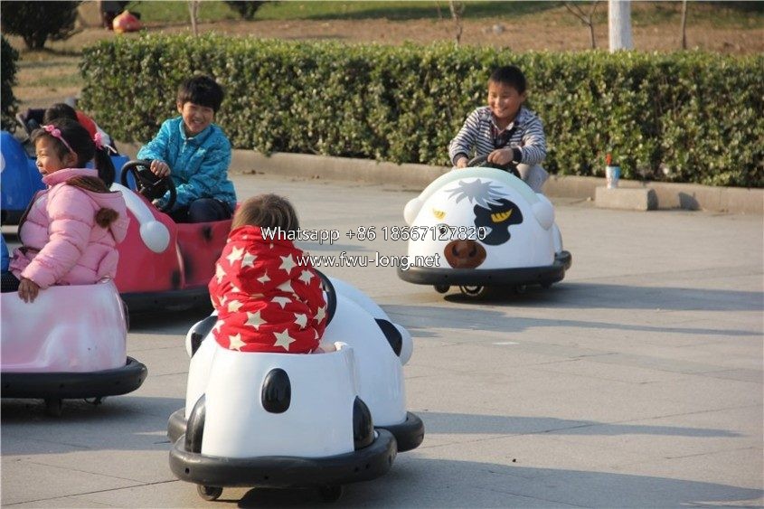 Kids drifting and bumping playing scene at indoor mall playground.JPG