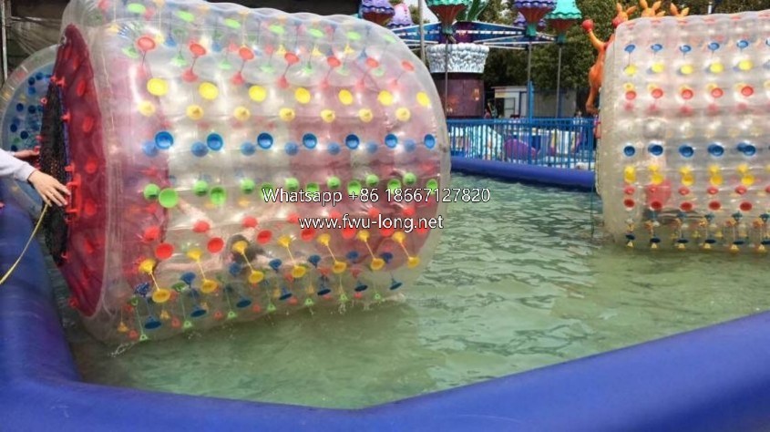 Full overall view of commercial inflatable water roller floating on pool water.jpg