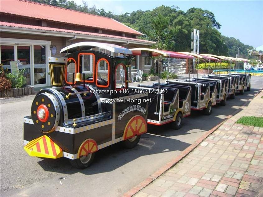 Full 6-carriage American style trackless tourist train.JPG