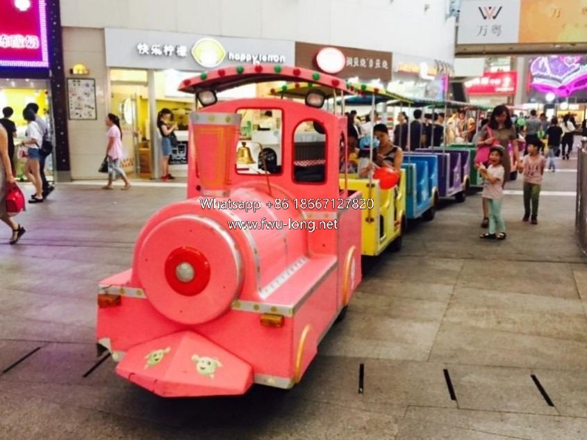 Trackless tourist train running on scenic flat road.JPG